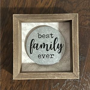 Small “Best Family Ever” sign.